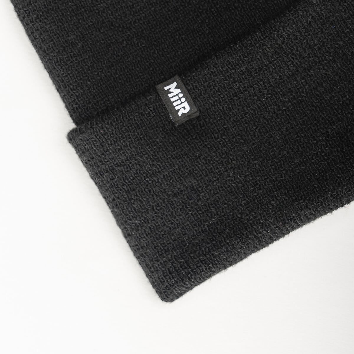 recycled-poly-fine-knit-beanie-i8 WebPDP-RecycledPolyFineKnitBeanie_Studio_TagDetail_Black__BNE005002OS.jpg