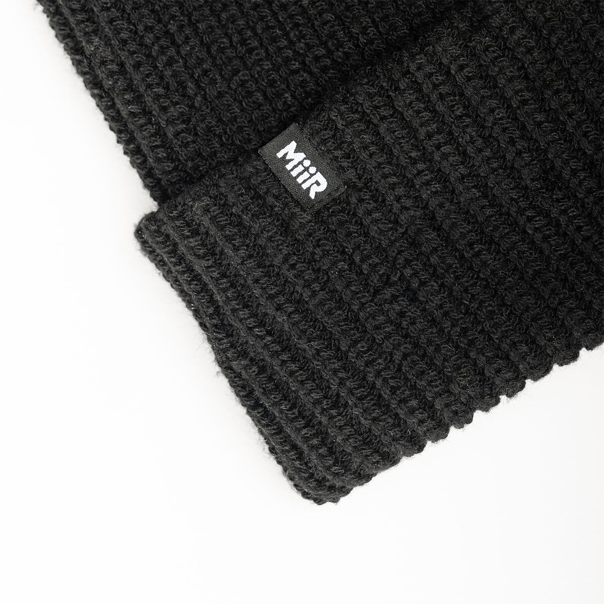 recycled-poly-rib-beanie-f7 WebPDP-RecycledPolyRibBeanie_Studio_TagDetail_Black__BNE002002OS.jpg